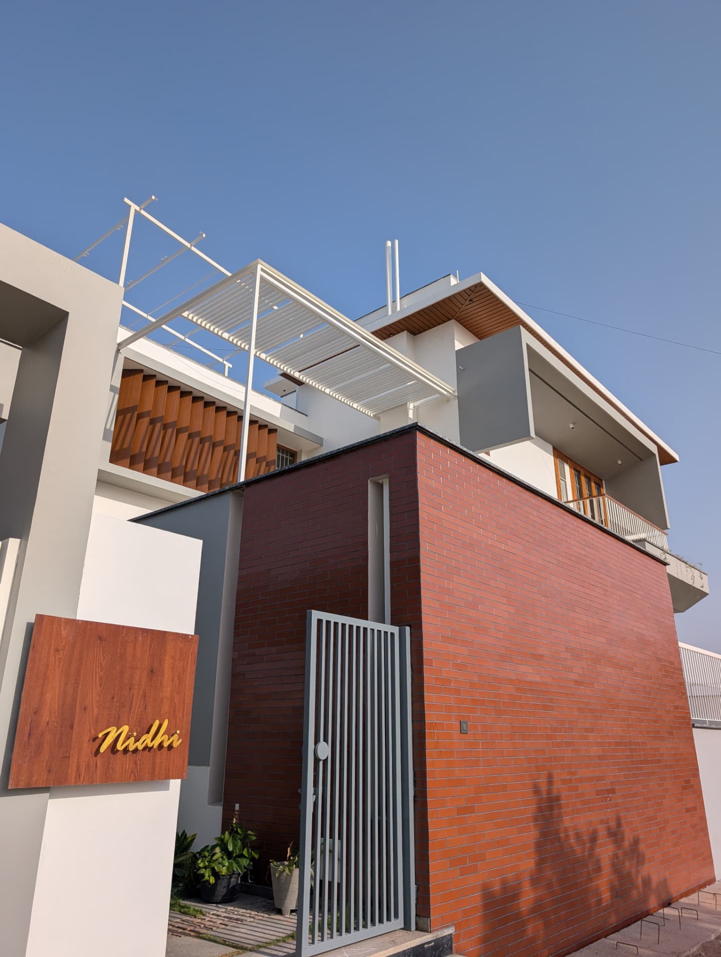 Mr. Naresh's Residence — Entrance gate & brick volume